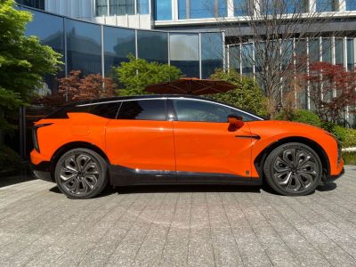 Electric SUV side profile with aerodynamic design and unique wheel rims