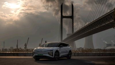 Futuristic electric SUV with aerodynamic shape and advanced lighting.