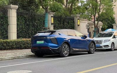 Futuristic rear design and aerodynamic electric SUV profile with alloy wheels