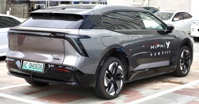 Rear and side view of futuristic electric SUV with distinctive rear lights and alloy wheels