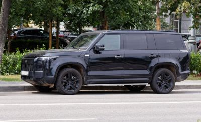 Large black full-size SUV side profile with distinct modern design