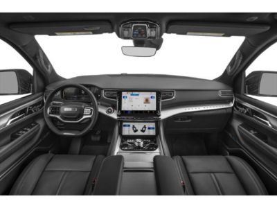 Luxury SUV interior with dual touchscreen displays and premium leather seats
