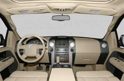 Beige leather dashboard, steering wheel, center console interior