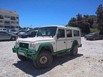 Off-road SUV with bulky bumper guard and green trims