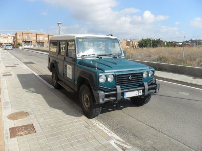 Off-road SUV front-side view with rectangular headlights and rugged bumper