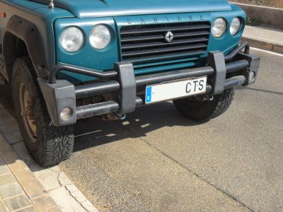 Front grille with dual round headlights and heavy bull bar