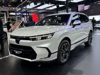 Sleek white SUV front with LED headlights and modern grille