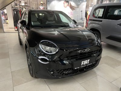 Front view of modern compact hatchback with round headlights