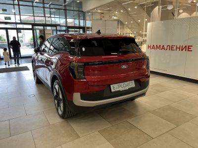 Red electric SUV rear with LED tail lights and modern wheels