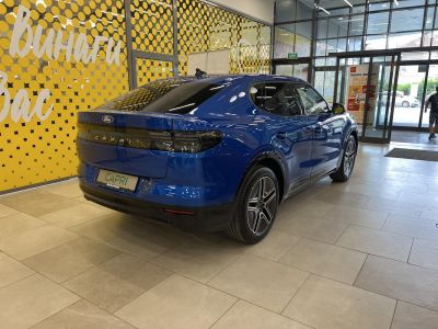 Rear side view of blue electric SUV with modern taillights
