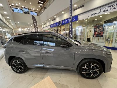 Side view of SUV with black alloy wheels and tinted windows