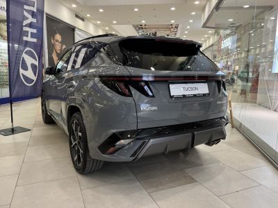 Rear view of 2024 Hyundai Tucson IV facelift with modern taillights and sporty bumper