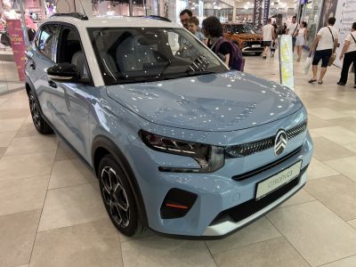 Front view with modern headlights and grille in light blue