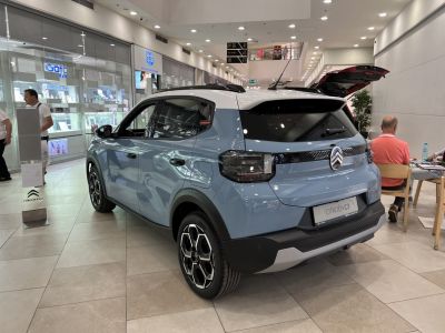 Rear view of a vehicle with alloy wheels and two-tone roof