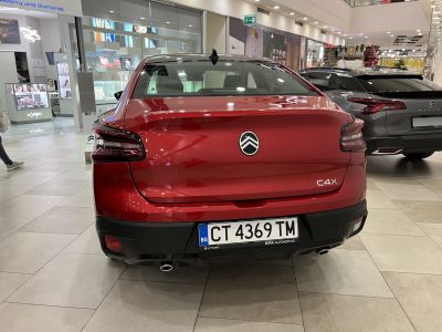 Rear view with distinctive tail lights and dual exhaust