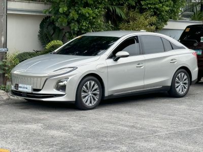Electric sedan with vertical slat grille and LED headlights