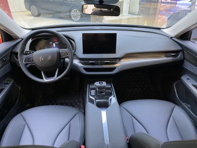 Digital dashboard, touchscreen, and steering wheel controls in a modern car interior