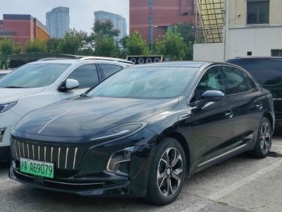 Electric sedan with vertical slat grille and sleek LED headlights