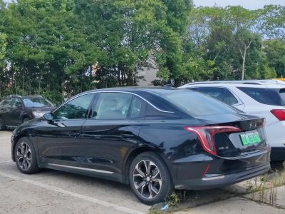 Sleek black sedan rear side with LED taillights and alloy wheels