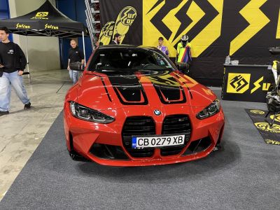 Front view with large kidney grille and sporty hood vents.