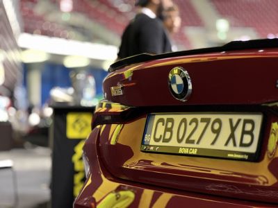 Close-up of BMW M4 rear with badge and license plate