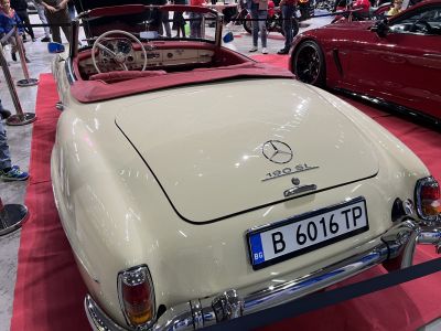 Rear view and interior of vintage convertible with red upholstery