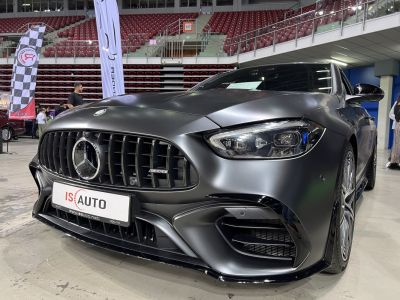 Close-up of front grille and headlight with sporty, aggressive design.