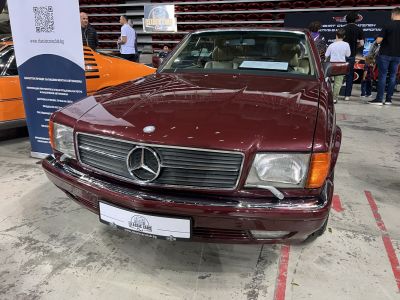 Front view of classic luxury coupe with chrome grille and headlights