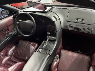 Leather bucket seats and center console with gear shift in convertible interior