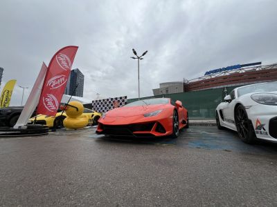 Aggressive front design and low stance of red Lamborghini Huracan EVO.