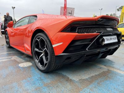 Rear wing, twin exhausts, unique alloy wheels, and rear diffuser.