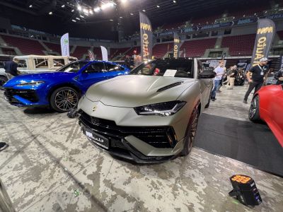 Aggressive front design of a luxury SUV with sharp LED headlights and sporty details