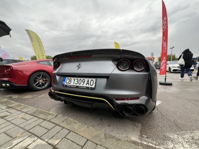 Rear view showing quad exhausts and circular taillights.