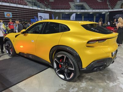 Yellow luxury SUV with carbon fiber accents and sporty wheels