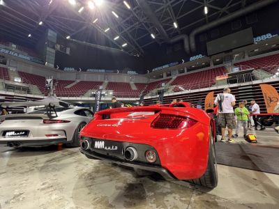 Rear view showcasing twin exhausts and sporty rear design.
