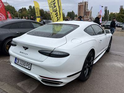Sleek rear design and black alloy wheels on luxury coupe