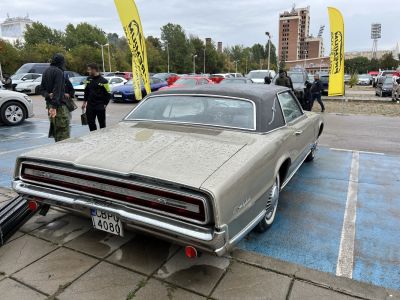 Rear view of classic coupe with wide taillights and vinyl roof