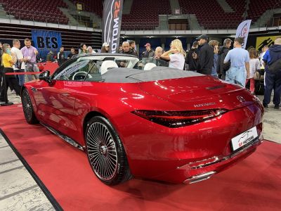 Luxury red convertible rear with convertible soft top and distinctive taillights
