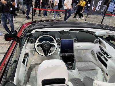 Luxurious white leather interior with digital cockpit and modern steering wheel