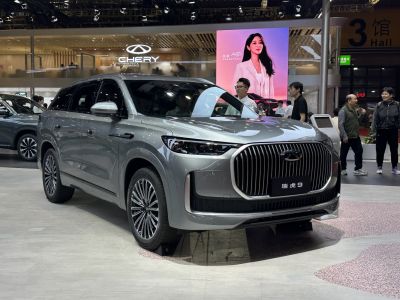 Modern SUV front with vertical grille bars and slim LED headlights