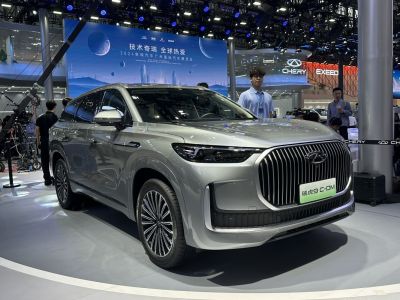 Front-right view of an SUV with large vertical grille and sleek LED headlights