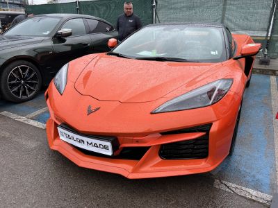 Front view with sleek headlights and aggressive styled bumper details
