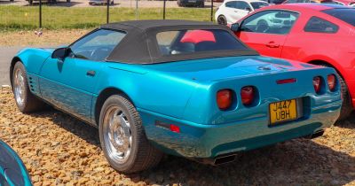 Convertible sports car with soft top and quad taillights