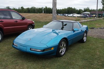 Blue 1991 Corvette C4 coupe with pop-up headlights