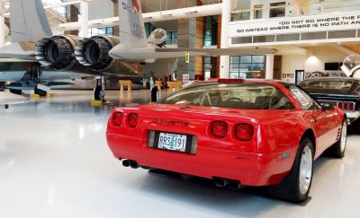 Red sports coupe rear with quad exhaust and taillights