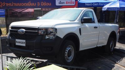 Front and side view of pickup truck with black grille and steel wheels
