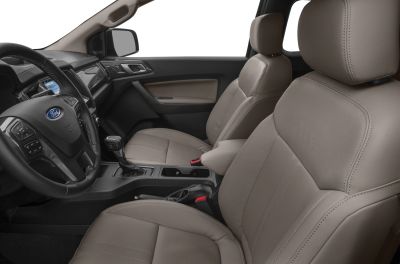 Premium beige leather seats and modern dashboard layout