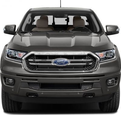 Front view featuring bold grille and LED headlights with muscular hood