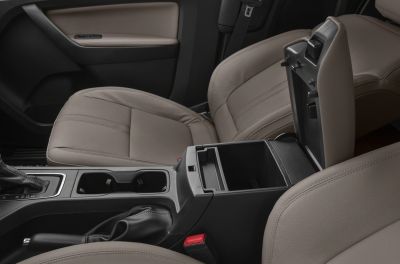 Open center console with spacious storage, beige leather seats