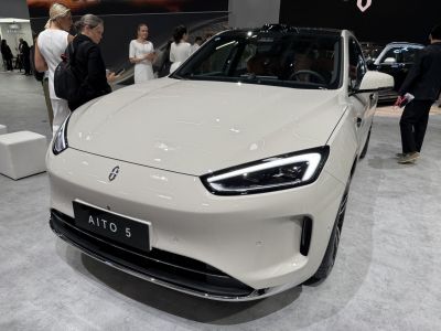 Sleek front view with sharp LED headlights and smooth aerodynamic hood